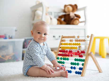 Baby Playing with Abacus