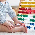 Baby Playing with Abacus