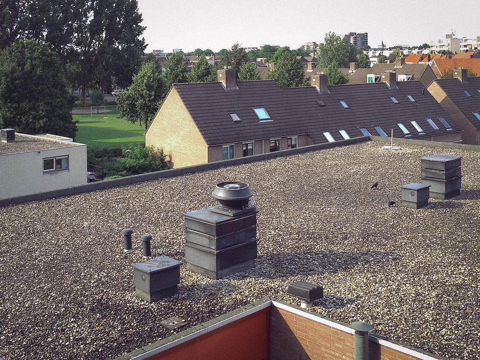 Roofer performing maintenance on a residential dark roof