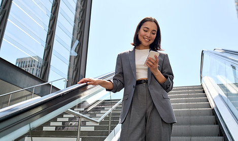 Businesswoman on Escalator
