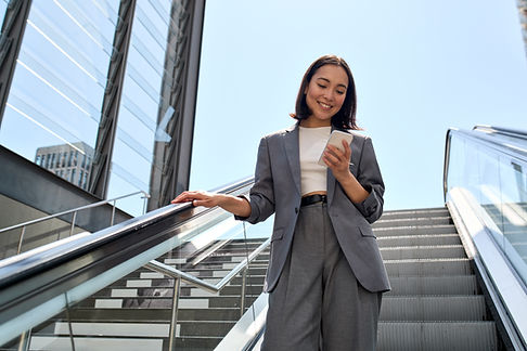 Businesswoman on Escalator
