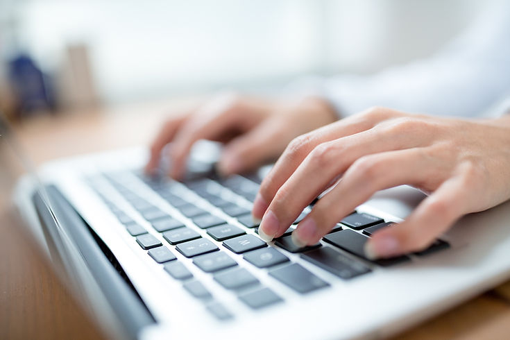 Typing on laptop