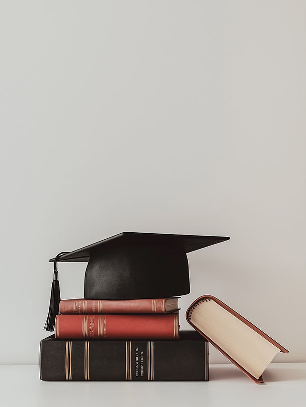 Graduation Cap on Books
