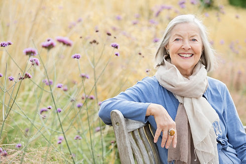 Older woman sitting on park bench