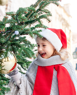 Girl Decorating the Christmas Tree