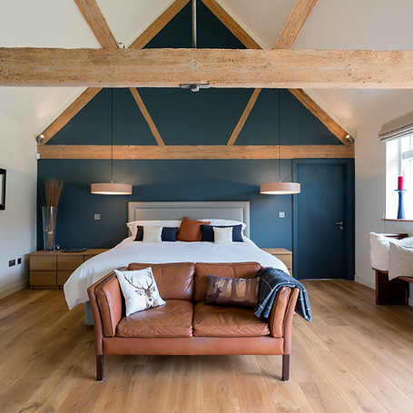 Bed and sofa in modern bedroom