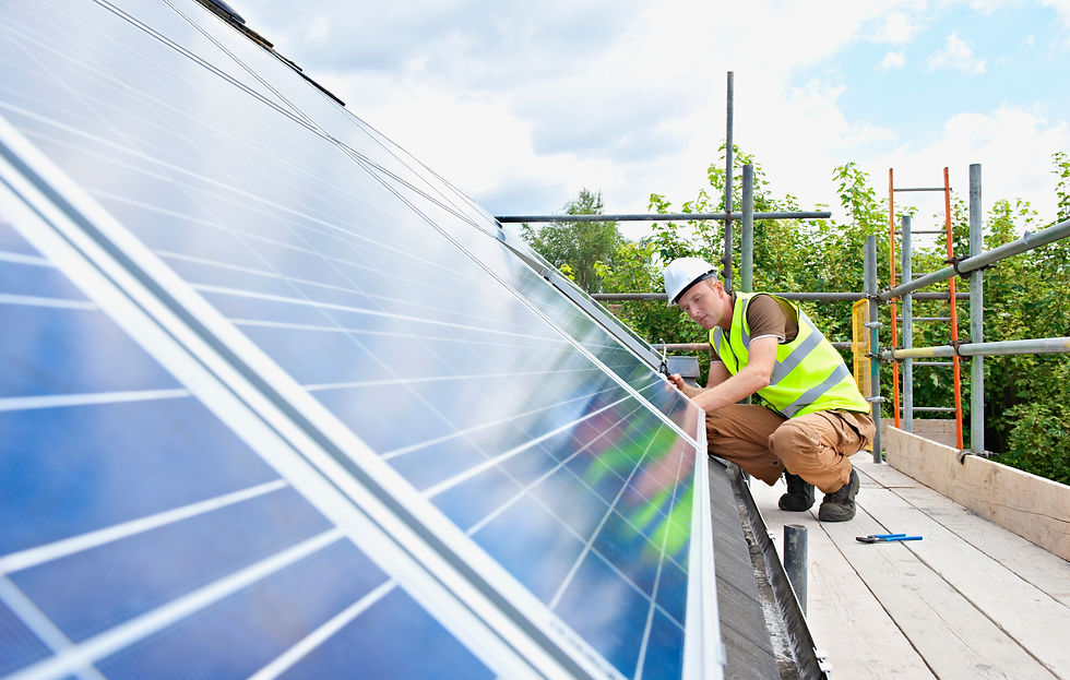 Solar panel technician standing on scaffolding