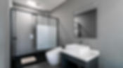 Bathroom with shower area, mirror and sink