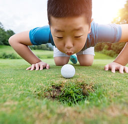 Boy Playing Golf