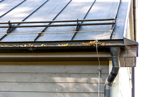 Rain gutter pipeline system installation. Roofing construction