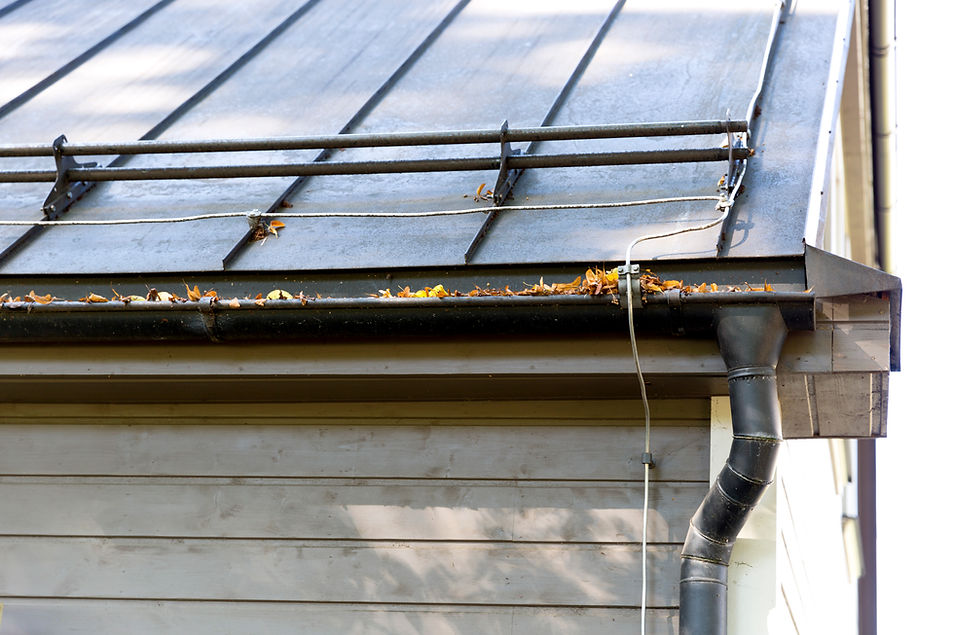 Rain gutter pipeline system installation. Roofing construction