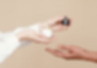 Hands Holding Serum