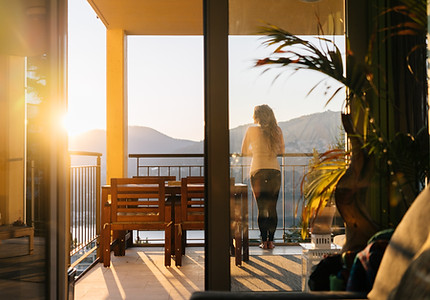 Person standing on a balcony