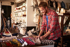 A man looking at goods at a store