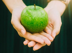 Holding an Apple