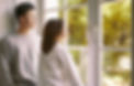 Couple Standing By Window