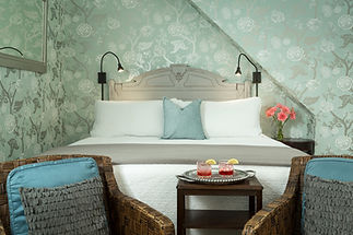 Bedroom with floral wallpaper