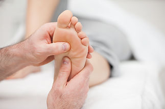 Patient receiving a foot massage