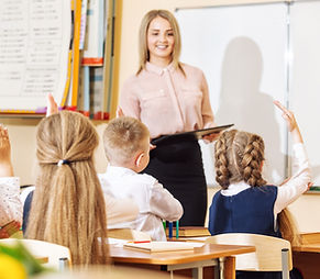 A teacher with her students in the classroom