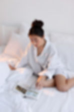 Lady Reading a Book in Bed