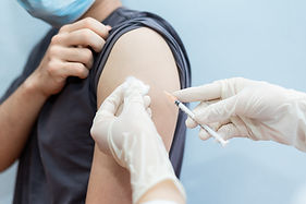 Asian man getting vaccinated