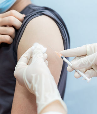 Asian man getting vaccinated