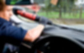 Man repairing and replacing the glass on a car