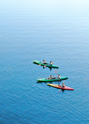 Colorful kayaks on water