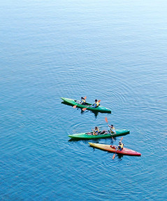 Colorful kayaks on water