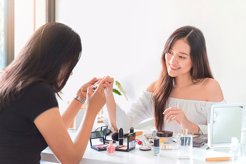 A woman getting nail painted