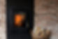 Fireplace in a brick wall and woods in basket