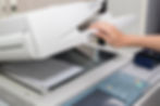 woman opening a photocopier