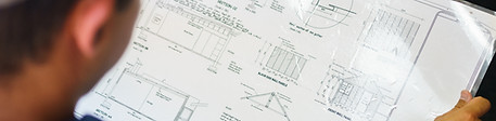 Engineer Reviewing Blueprint