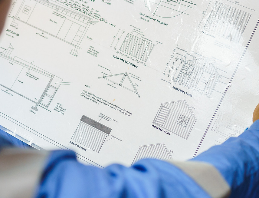 Engineer Reviewing Blueprint