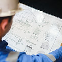 Engineer Reviewing Blueprint