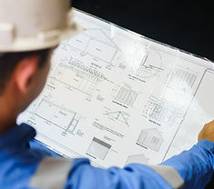 Engineer Reviewing Blueprint