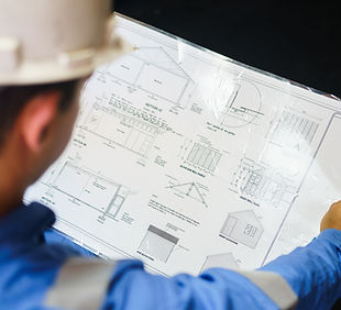 Engineer Reviewing Blueprint