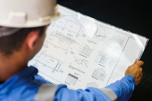 Engineer Reviewing Blueprint