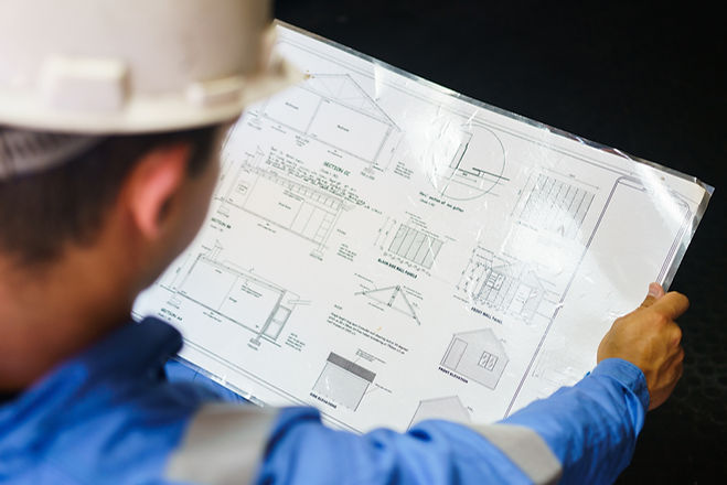 Engineer Reviewing Blueprint