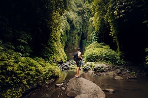 Guest walking along lush jungle nature trails at RAMA plant medicine sanctuary Costa Rica