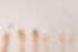 Hands holding vials up