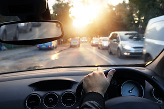 Driving car around town in sunny end of a day; Shutterstock ID 220331212; PO: N/A; Job: PD