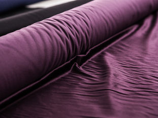 Roll of purple fabric.