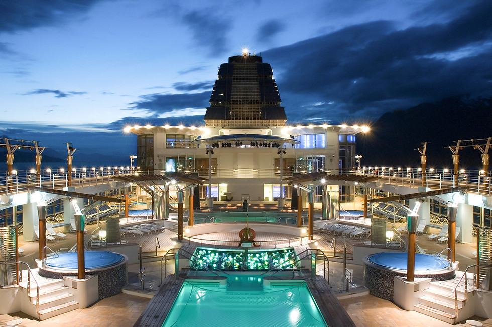 Luxury cruise ship at night with pools