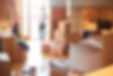 a young couple unpack their belongings as they settle into their new loft apartment . They