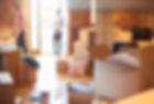 a young couple unpack their belongings as they settle into their new loft apartment