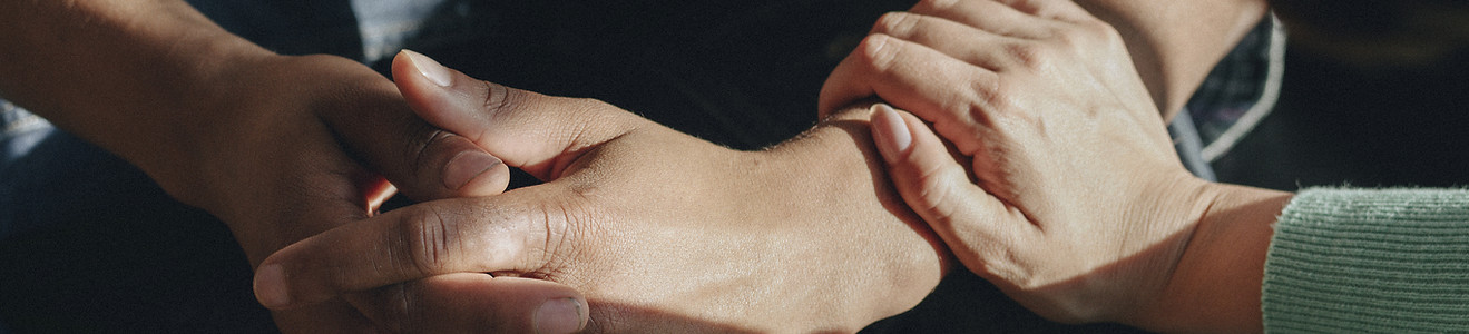 Closeup of comforting hands