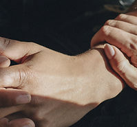 Closeup of comforting hands