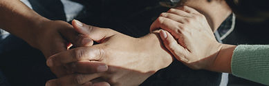 Closeup of comforting hands