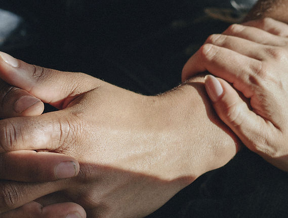 Closeup of comforting hands
